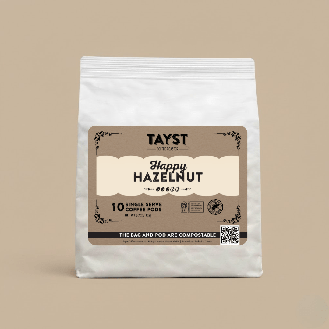 Tayst Happy Hazelnut coffee pod package on a beige background