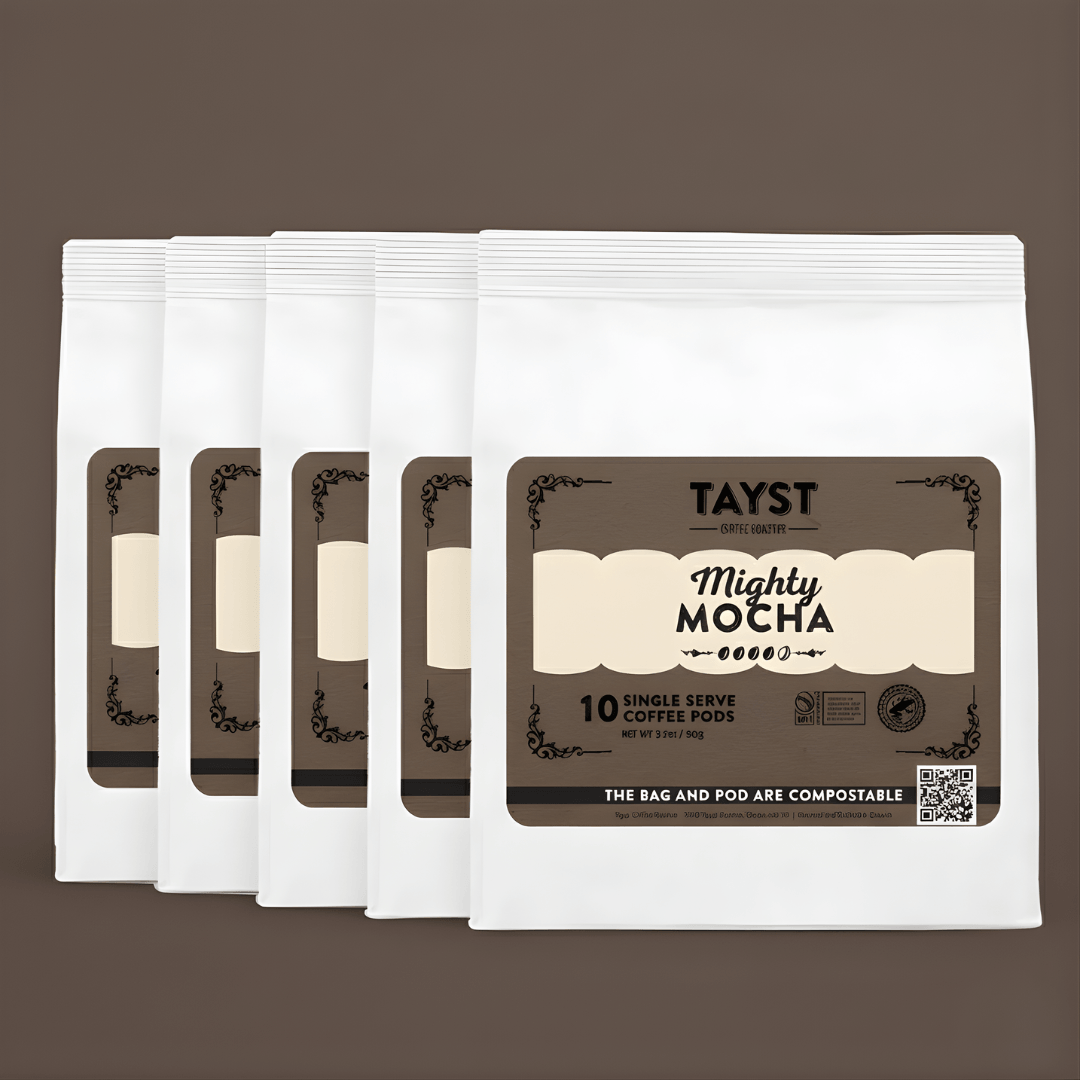 Pack of Tayst Mighty Mocha coffee pods on a brown background