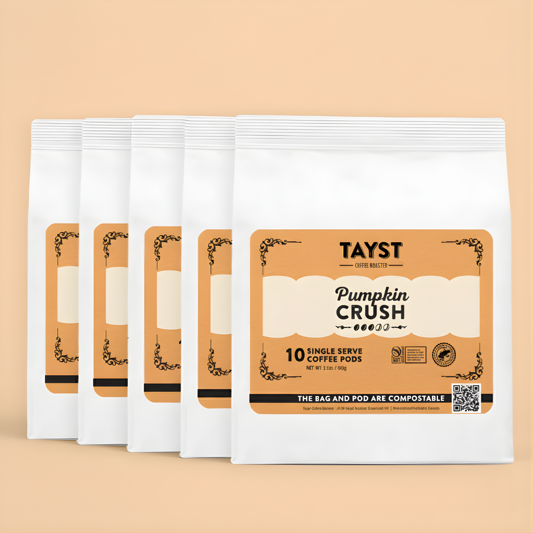 Pack of Tayst Pumpkin Crush single serve coffee pods on a beige background