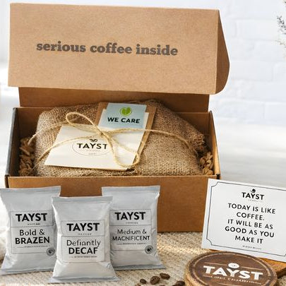 Tayst coffee packaging with a cardboard box labeled 'serious coffee inside' with frack packs