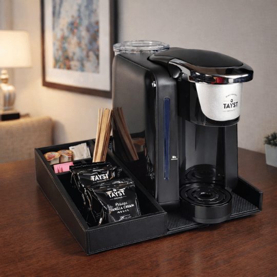 Tayst coffee machine with accessories on a wooden surface