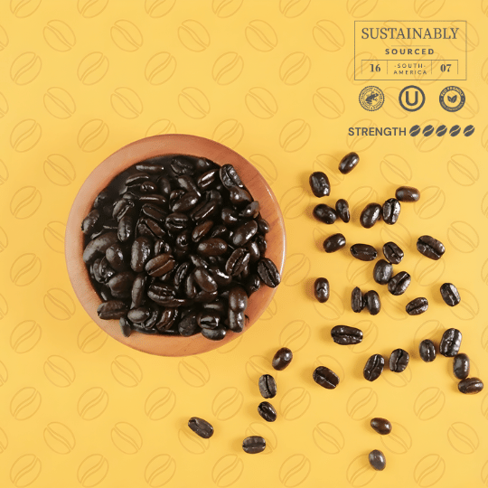 Coffee beans in a wooden bowl on a yellow background with coffee bean patterns and sustainability labels.