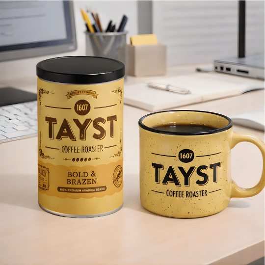 Tayst ground coffee and mug on a desk with office background