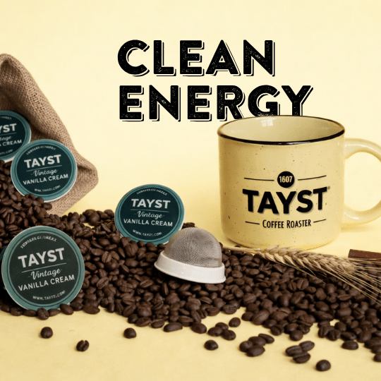 TAYST coffee products including a mug, keurig pods, and coffee beans on a beige background with 'Clean Energy' text.