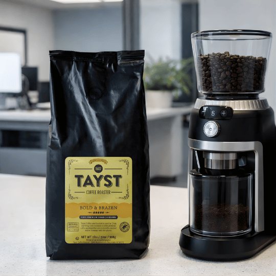 Tayst coffee bag and coffee grinder on a counter in an office setting